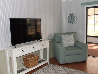 LARGE GREEN SPACE FACING THE WATER FROM A LARGE FLORIDA ROOM - photo 14