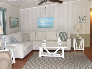 LARGE GREEN SPACE FACING THE WATER FROM A LARGE FLORIDA ROOM - photo 18