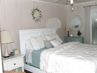 LARGE GREEN SPACE FACING THE WATER FROM A LARGE FLORIDA ROOM - photo 19