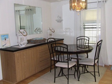 LARGE GREEN SPACE FACING THE WATER FROM A LARGE FLORIDA ROOM - photo 20