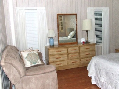 LARGE GREEN SPACE FACING THE WATER FROM A LARGE FLORIDA ROOM - photo 23