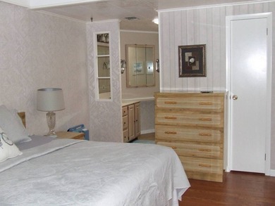 LARGE GREEN SPACE FACING THE WATER FROM A LARGE FLORIDA ROOM - photo 24