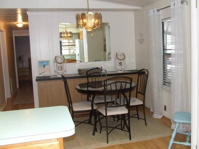 LARGE GREEN SPACE FACING THE WATER FROM A LARGE FLORIDA ROOM - photo 33
