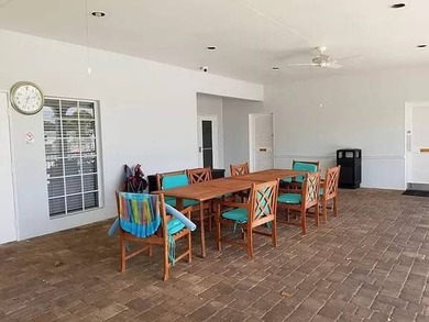 LARGE GREEN SPACE FACING THE WATER FROM A LARGE FLORIDA ROOM - photo 40