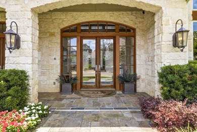 Tucked beneath the mature trees of Bent Tree North, this custom - photo 2