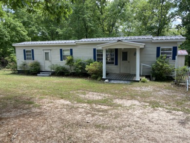 Well kept 2 bed/1 bath mobile home that sits on 0.35 Ac. This - Lake Home Sale Pending in Tignall, Georgia
