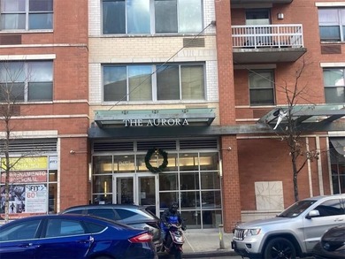 This unit is part of the lovely Aurora Condominium which boasts - photo 1