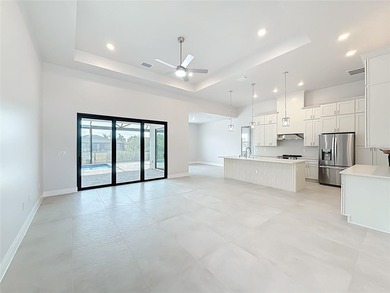 BRAND NEW WATERFRONT MASTERPIECE WITH GULF ACCESS. Welcome to - photo 7