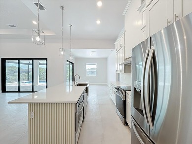 BRAND NEW WATERFRONT MASTERPIECE WITH GULF ACCESS. Welcome to - photo 9