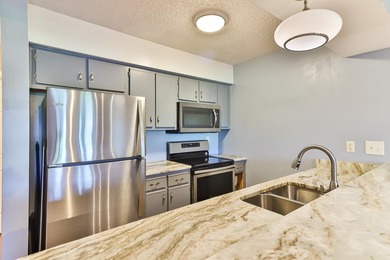 Welcome to 4990 Windsor Green Way, Unit 102, a first-floor condo