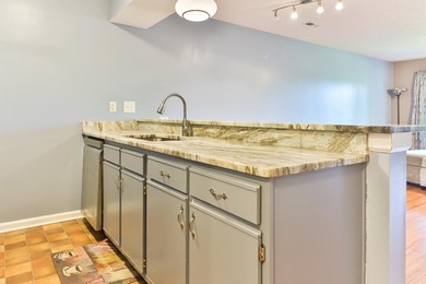 Welcome to 4990 Windsor Green Way, Unit 102, a first-floor condo