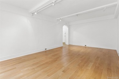Welcome home to this beautifully renovated studio co-op in the - photo 4