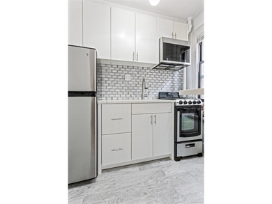 Welcome home to this beautifully renovated studio co-op in the - photo 6