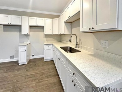 Bank owned property. This 2-bedroom, 2-bath home features an - photo 2
