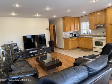 Welcome to 1066 East 100th Street, a well-maintained two-family - photo 3