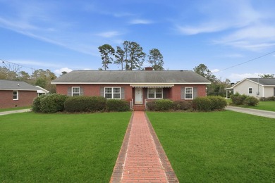 There's something special about a classic brick home on a quiet - photo 3