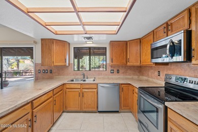 This charming standalone townhome in a welcoming 55+ Green