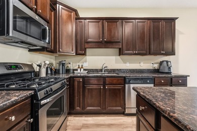 Newer LVP flooring flows through this open-concept Hammock Bay - photo 10