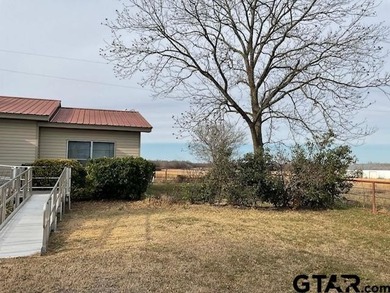 Charming 3 bedroom, 2 bath home situated on approximately .41