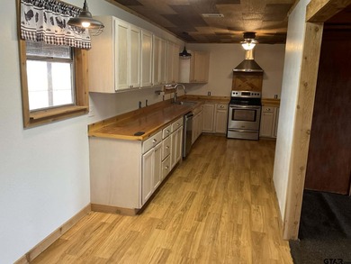 Charming 3 bedroom, 2 bath home situated on approximately .41