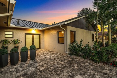 Stunning Modern Home with Heated Pool! Situated in desirable - photo 1