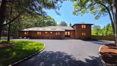 A sweeping circular driveway welcomes you to this ultra-private - photo 2