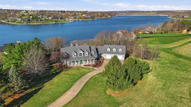 Perched along a pristine stretch of shoreline, this ideal lake - photo 1