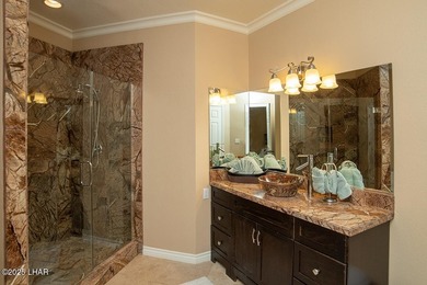 Nestled on the 4th fairway in RESIDENTIAL ESTATES, this stunning - photo 25