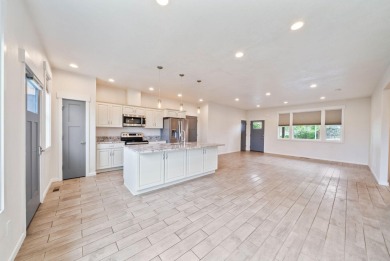 Built in 2018, this lightly lived-in, wheelchair accessible home