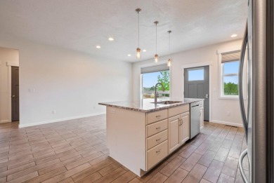 Built in 2018, this lightly lived-in, wheelchair accessible home