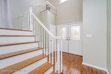 Welcome to this well maintained two-family detached side hall - photo 9