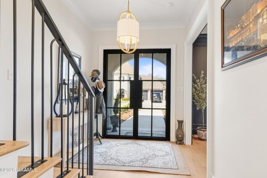 Located in the prestigious gated golf community of Le Triomphe