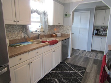 Listed by the Official Sales Team of Jamaica Bay Village. Move - photo 8