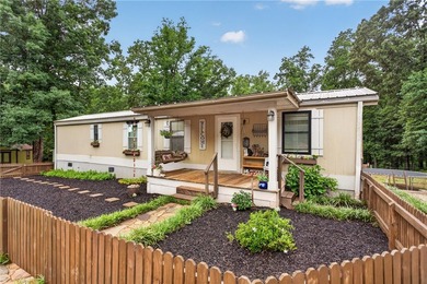 Tucked away on 9.98 secluded acres, this 3 bedroom, 1 bath home - photo 1