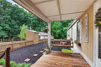 Tucked away on 9.98 secluded acres, this 3 bedroom, 1 bath home - photo 2