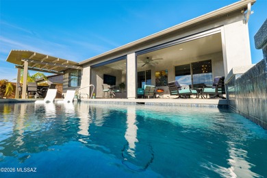 Set on a premium corner lot in the prestigious, gated 55+