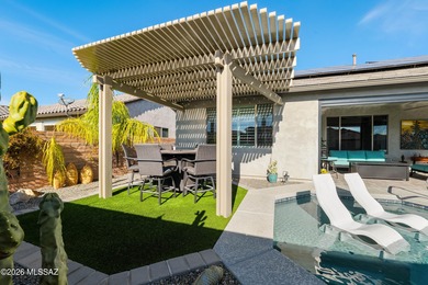 Set on a premium corner lot in the prestigious, gated 55+