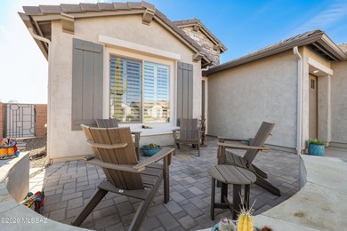 Set on a premium corner lot in the prestigious, gated 55+