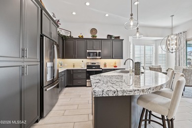 Set on a premium corner lot in the prestigious, gated 55+