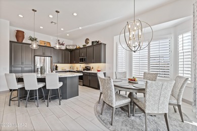 Set on a premium corner lot in the prestigious, gated 55+