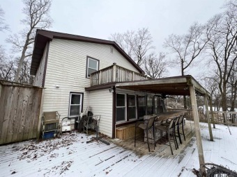 Check out the deck space on this riverfront home! A boat ride - Lake Home For Sale in Monticello, Indiana