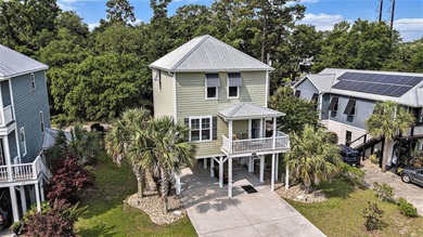 Inlet Living at Its Best! Welcome to this charming raised beach
