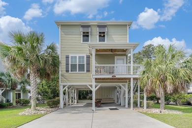 Inlet Living at Its Best! Welcome to this charming raised beach