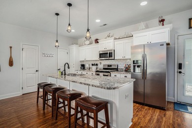 Inlet Living at Its Best! Welcome to this charming raised beach