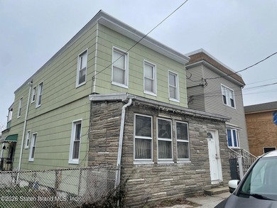 Two family residence in need of updating, offering a strong - photo 2