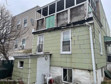 Two family residence in need of updating, offering a strong - photo 4
