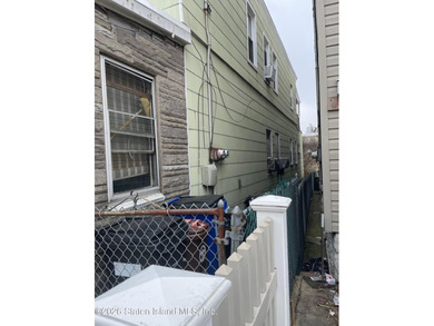Two family residence in need of updating, offering a strong - photo 5