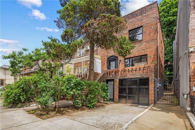 Welcome to this completely renovated two-family home in the - photo 2