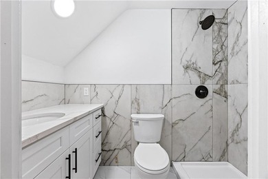 Welcome to this completely renovated two-family home in the - photo 5