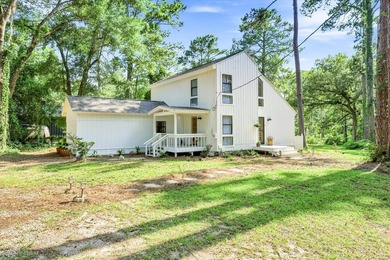 Welcome to this gorgeous 4-bedroom, 2-bath lakefront home - photo 2
